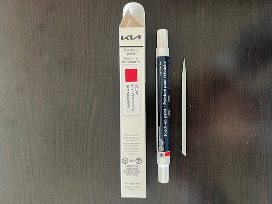 Kia Canada touch up Inferno red paint pen ajr ajt on wooden surface for stone chips