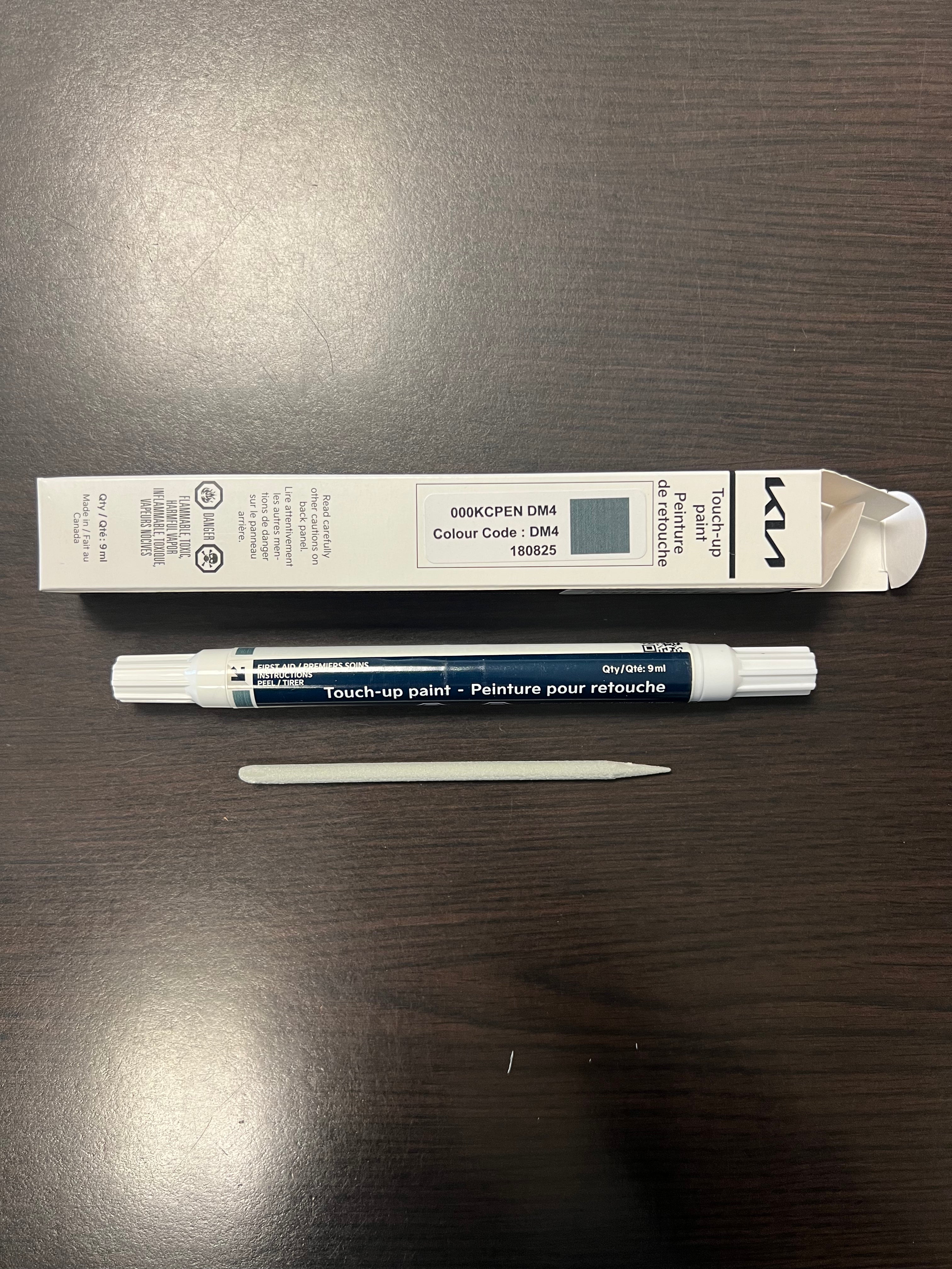 Kia Canada touch up morning haze paint pen dm4 on wooden surface for stone chips