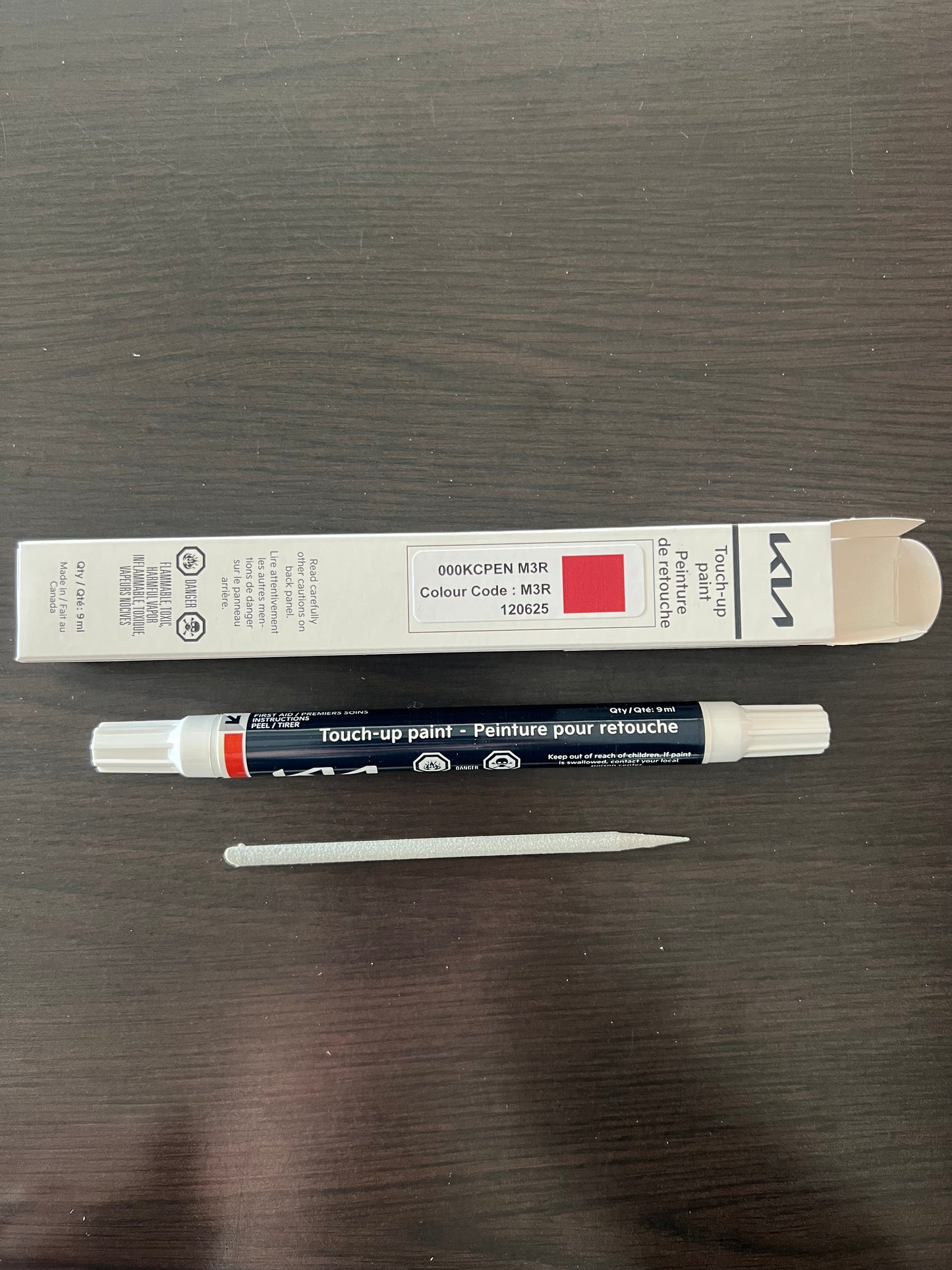 kia canada touch up lunar orange paint pen m3r m4a on a wooden surface for stone chips