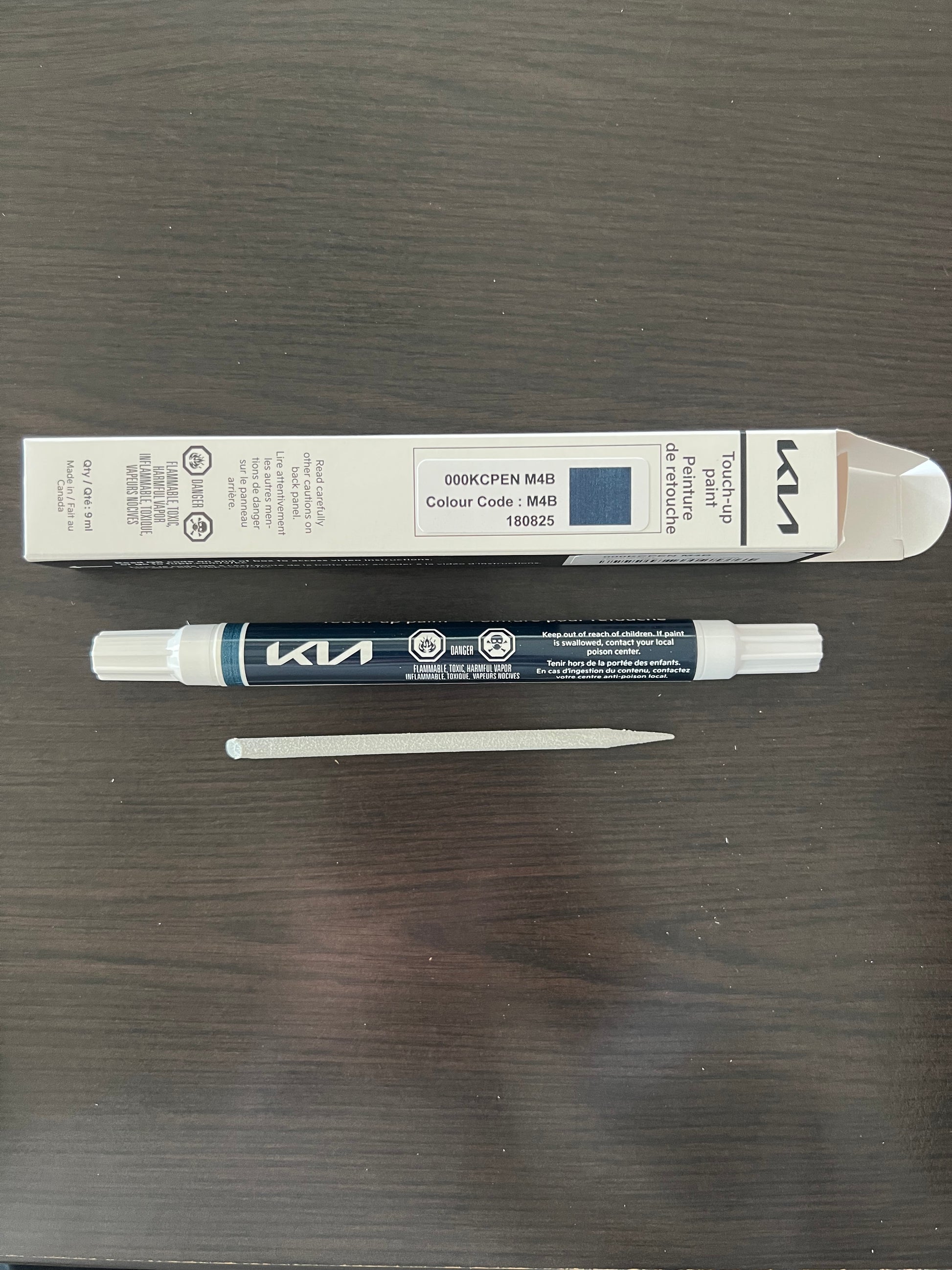 Kia canada touch up mineral blue paint pen m4b on a wooden surface for stone chips